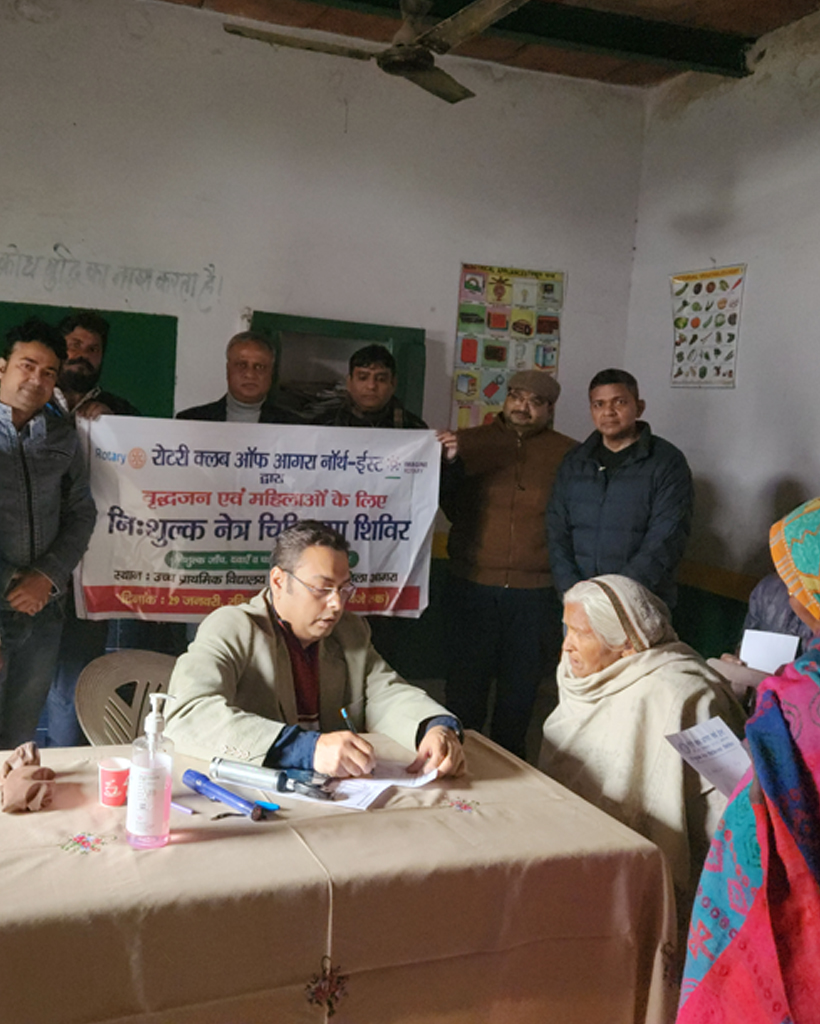 Optometrist looking at eye chart